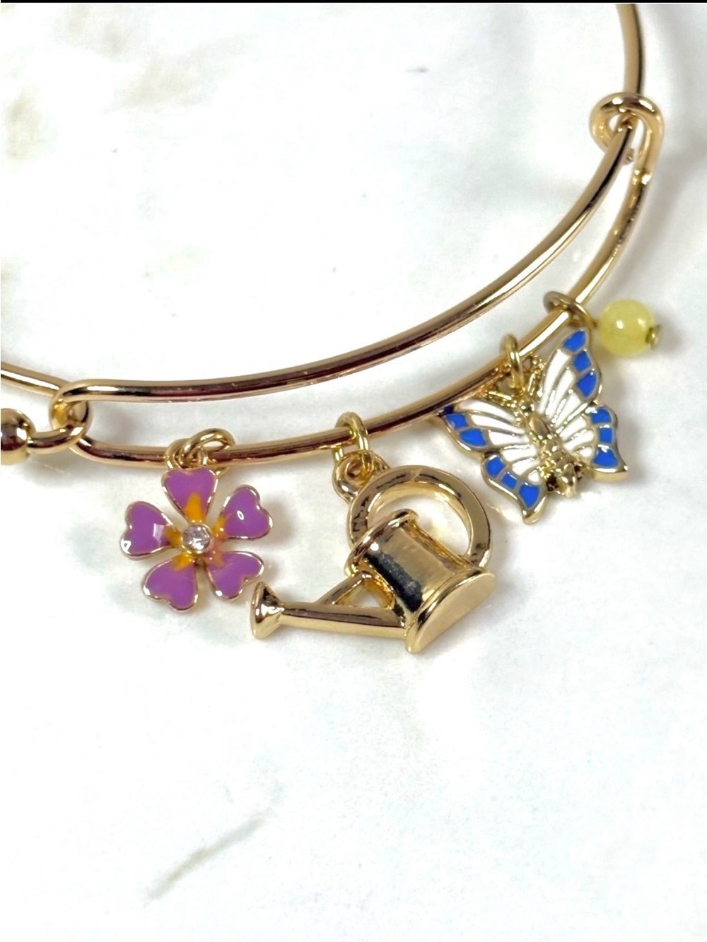 Avon Gold Tone Butterfly Floral Charm Hinged Bangle Bracelet Watering Can NIB